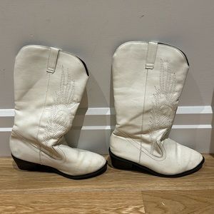 White faux leather cowboy boots with black heels